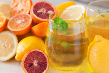 Detox citrus water, refreshing summer homemade lemonade cocktail with lemon and orange