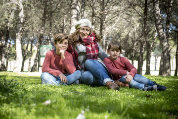 Fototapeta na wymiar Mother with her children in the park