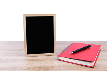 Concept business or education : Red book with pen and blackboard put on wooden table isolated on white background