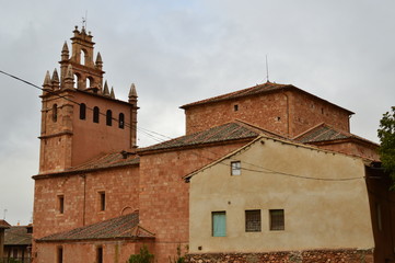 Obraz premium Beautiful Bell Tower In This Picturesque Village With Its Black Slate Roofs In Madriguera. Architecture Vacation Travel Rural Life. October 21, 2017. Madriguera Segovia Castilla Leon. Spain.