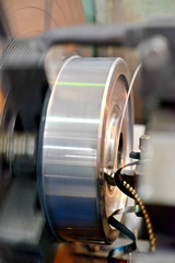 Fototapeta premium The metal part is machined on a lathe