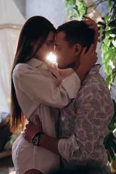 Passionate kiss of a young couple.