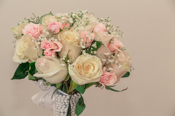 Bride´s beautiful bouquet of white and pink roses. Concept happily ever after. Closeup of wedding bloomed bouquet isolated.