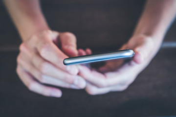 hands holding phone macro - girl uses smartphone closeup