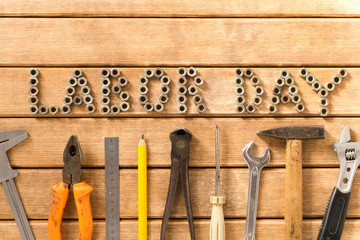 Labor day.  Different tools on a wooden table