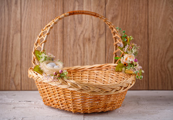 Fototapeta na wymiar Beautiful decorative basket with flowers to celebrate Easter