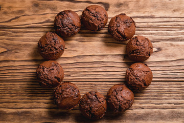 chocolate muffins on a wooden table
