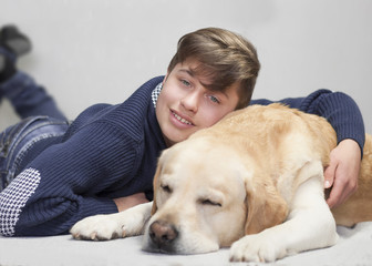 teenager boy and labrador