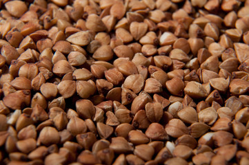 Buckwheat grains background - healthy food with vitamins