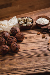 chocolate muffins on a wooden table