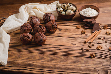 chocolate muffins on a wooden table
