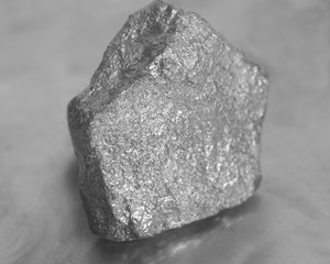 Silver nugget on gray background
