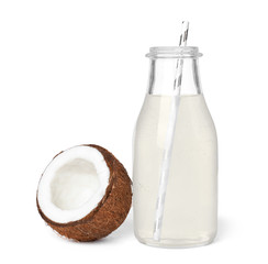 Bottle of coconut water and fresh nut on white background © New Africa