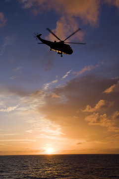 Silhouette of helicopter