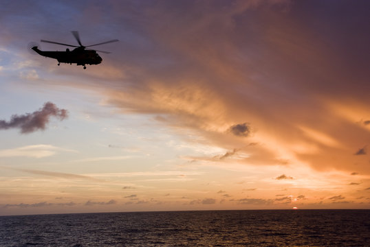 Silhouette of helicopter