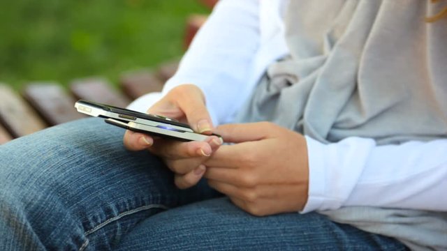Woman sending digital message