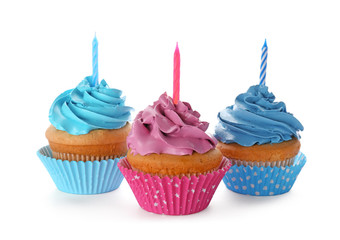 Birthday cupcakes with candles on white background