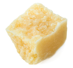 Parmesan cheese pieces isolated on white background. 