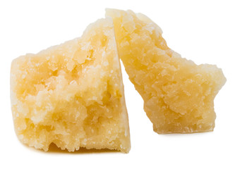 Parmesan cheese pieces isolated on white background. 