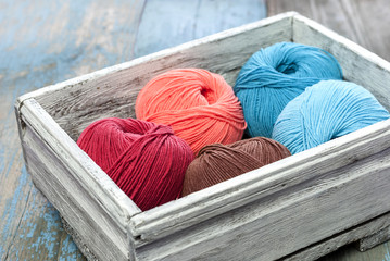 Knitting yarn in a old wooden box