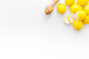 yellow citrus fruit set with lemons white background top view mock-up