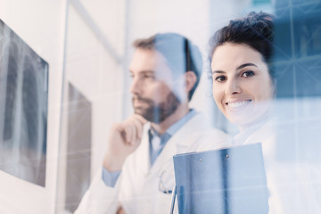 Doctors team examining a patient's x-ray