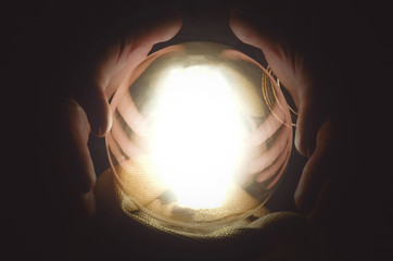 Fortune teller reading future with crystal ball. Seance concept.