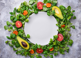 A frame of corn lettuce around the plate. 