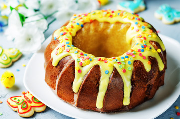 Easter Bundt cake with colorful topping and Easter Cookies