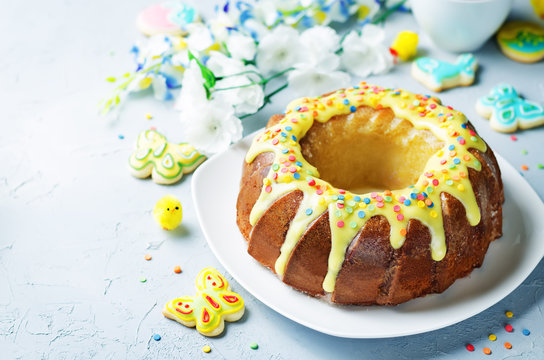 Easter Bundt Cake With Colorful Topping And Easter Cookies