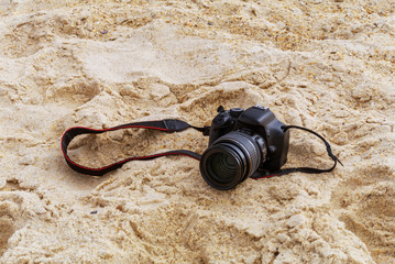 Photo camera in the sand