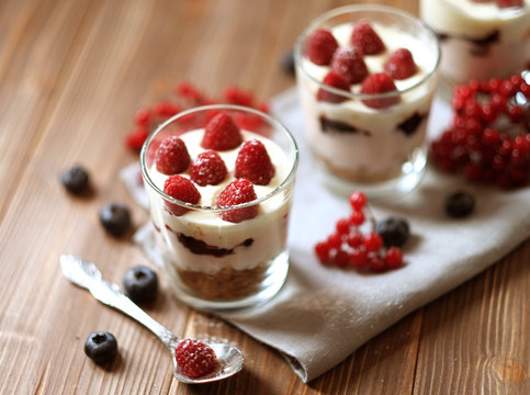 Natural yogurt with fresh berries and muesli. Healthy dessert.