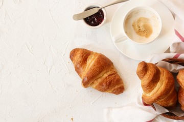 Freshly baked Butter Croissant cup of coffee jam Breakfast setting