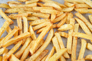 Homemade french fries on a tray background, closeup shot