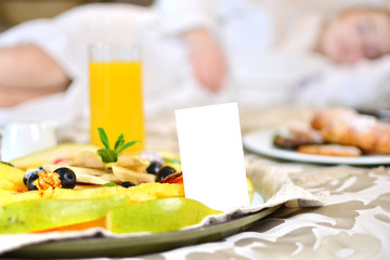 Background with a fruit set in a bed with woman on a back drop.