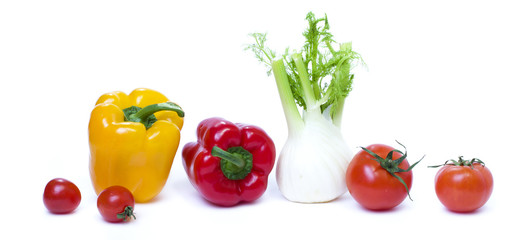 Root of parsley of red pepper with yellow pepper and tomatoes on white background.