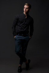 Fototapeta premium Portrait of handsome, man against dark background.