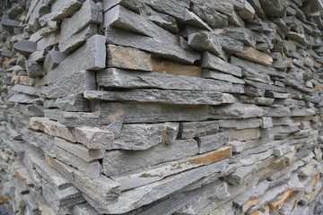 Stacked horizontal gray stone plates