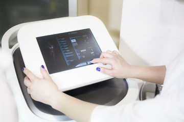 Hands of the doctor at the computer