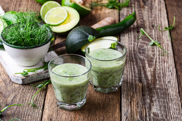 Green pear sprouts, fresh vegetables and smoothie for healthy meal