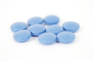 Blue tablets isolated in white background