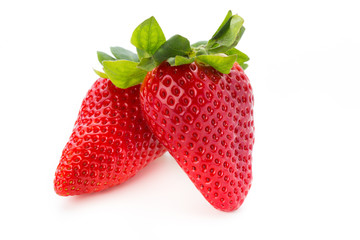 Fresh strawberries close up on white background.