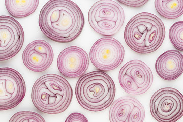 Onion isolated on white background, top view. Wallpaper abstract composition of vegetables.