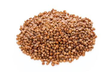 Buckwheat grains isolated on the white background.