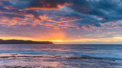 Fototapeta na wymiar Sunrise Seascape with Clouds