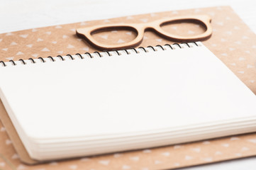 Notebook, wooden glasses