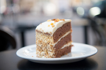 Cake with cream, food. Cake slice on white plate in paris, france, dessert. Temptation, appetite concept. Dessert, food, snack, pastry. Cuisine, menu, dish, recipe
