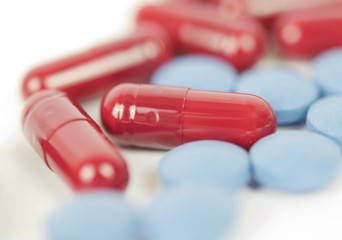 Red capsules and blue tablets isolated