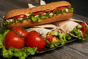 Burrito with grilled chicken and vegetables, Shawarma Sandwich, Doner Kebab, Chicken Shawarma, Subway sandwich on wooden table