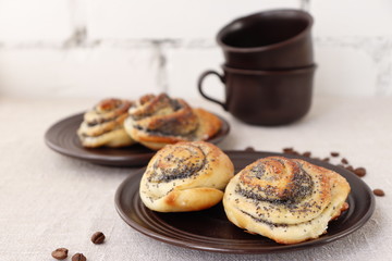 Buns of yeast dough with a poppy filling